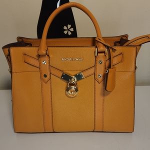 Orange Michael Kors Bag, Blue Michael Kors backpack. Olive green Guess backpack,